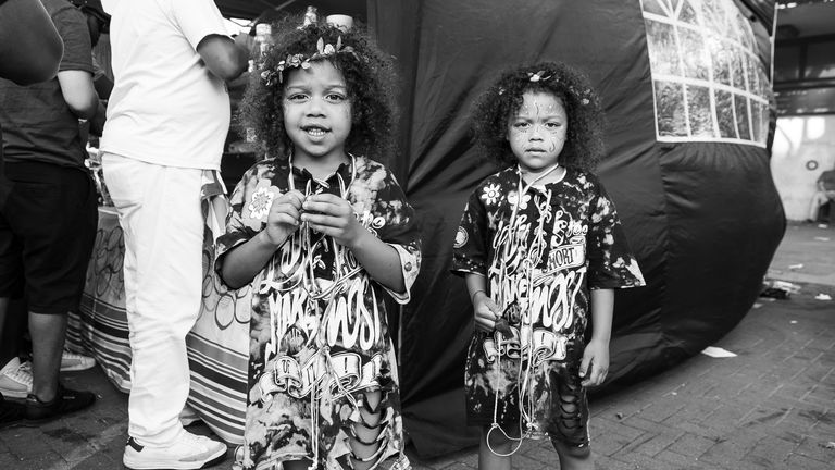 EMBARGOED TO 0001 FRIDAY OCTOBER 6 Undated handout photo taken by Rio Blake of two little girls at the Notting Hill Carnival. Rio is to take part in an exhibition called Here & Now: Black History Month Exhibition at Brady Arts Centre in Tower Hamlets, run by Alternative Arts, where she will unveil never-before-seen images of the Notting Hill Carnival. Rio specialises in documentary and portrait photography, and started her journey in the field taking pictures of the Notting Hill Carnival. Issue 