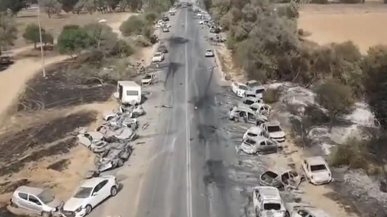 Vehicles lay abandoned outside a music festival in Israel following an attack by Hamas