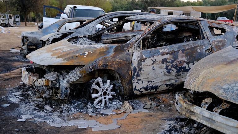 Burnt-out cars at the site of the Nova Festival massacre