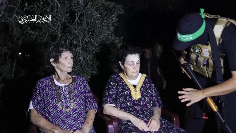 Yocheved Lifshitz  (L) and Nurit Cooper with a Hamas fighter shortly before their release