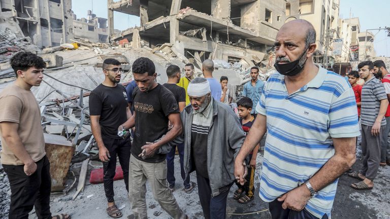  Palestinians help an injured elderly Palestinian man following overnight Israeli air strikes on the Rafah refugee camp 
Pic:DPA/AP