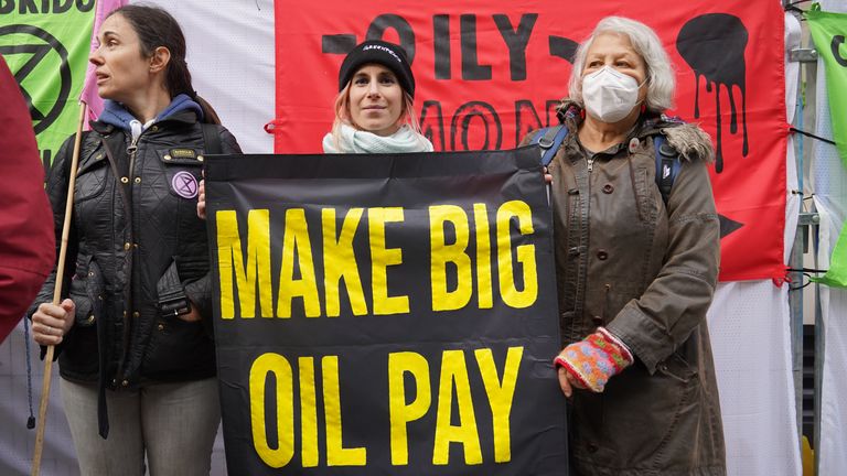 Activists from Fossil Free London outside the InterContinental in central London, demonstrate ahead of the Energy Intelligence Forum, a gathering between Shell, Total, Equinor, Saudi Aramco, and other oil giants