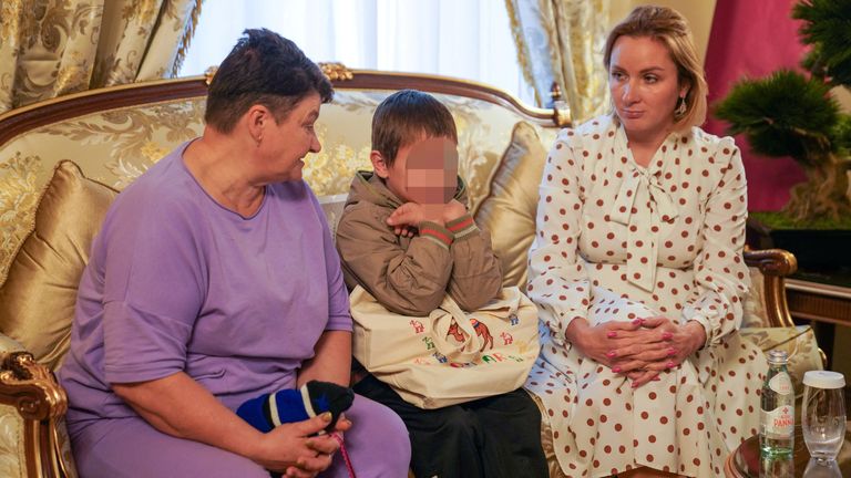 A 7-year-old Ukrainian boy, who is the first child released under a new mechanism Qatar has set up with the goal of repatriating children from Russia to Ukraine, is seated next to his grandmother (L) and Russia&#39;s Commissioner for Children&#39;s Rights, Maria Lvova-Belova after being released to Qatari diplomats 