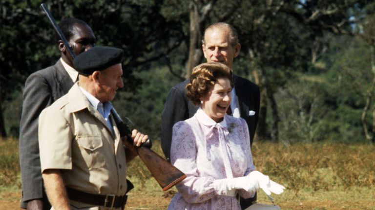 Queen Elizabeth II and the Duke of Edinburgh with guard-guide Dick Prickett (left) at Treetops Hotel, Aberdare National Park