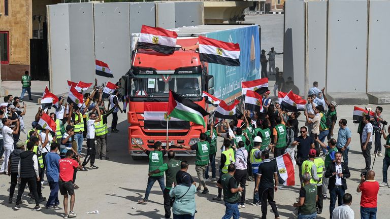 Aid convoy trucks return to the Egyptian side after delivering aid to the Gaza Strip through the Rafah border crossing
