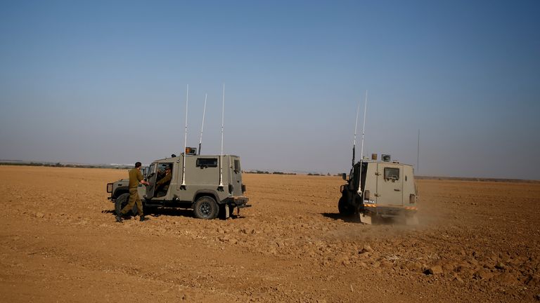 Israeli soldiers drive military jeeps as they search the area following what the Israeli army said was a rocket fired from the Gaza Strip landing in an open area, near Re&#39;im in southern Israel, October 6, 2016. REUTERS/Amir Cohen
