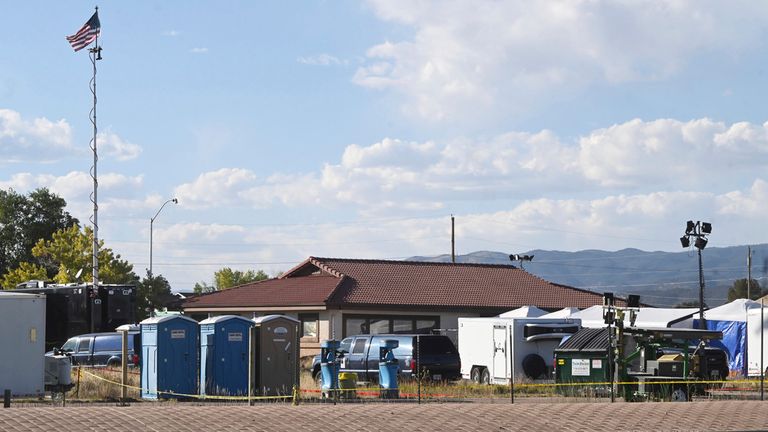 Tents and temporary structures can be seen on Monday, Oct. 9, 2023, at the Return to Nature Funeral Home, where over 100 decomposing bodies were found last week in Penrose, Colo. (Jerilee Bennett/The Gazette via AP)