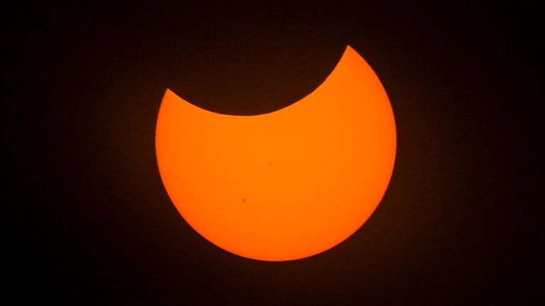 A partial solar eclipse is seen at the Griffith Observatory to watch the solar eclipse in Los Angeles Saturday, Oct. 14, 2023. (Ringo Chiu via AP)