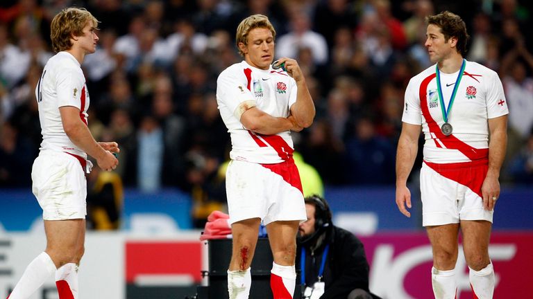 England&#39;s Mathew Tait (L), Jonny Wilkinson (C) and Andy Gomarsall react after receiving their loser&#39;s medals after being beaten by South Africa in the Rugby World Cup final at the Stade de France in Saint-Denis, near Paris October 20, 2007. REUTERS/Eddie Keogh (FRANCE)
