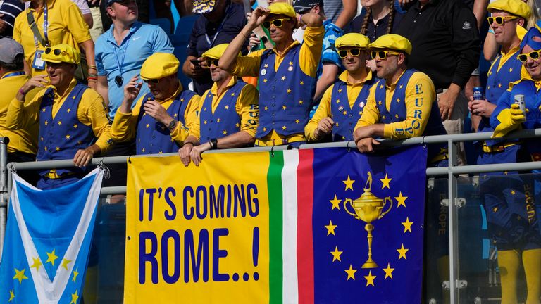Fans line the 1st tee stands ready for the start of the final day singles matches at the Ryder Cup golf tournament at the Marco Simone Golf Club in Guidonia Montecelio, Italy, Sunday, Oct. 1, 2023. (AP Photo/Alessandra Tarantino)