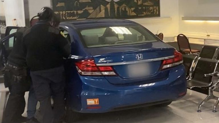 People evacuate as security personnel respond to the driver of a car which crashed into the Chinese consulate in San Francisco, California, U.S. October 9, 2023 in this screen grab obtained from social media video. Sergii/via REUTERS THIS IMAGE HAS BEEN SUPPLIED BY A THIRD PARTY. MANDATORY CREDIT. NO RESALES. NO ARCHIVES.