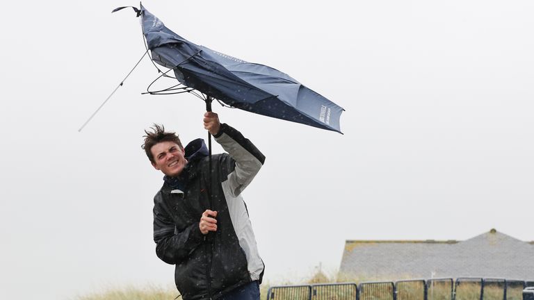 A spectator struggles with his umbrella at the Alfred Dunhill Links Championship at St Andrews