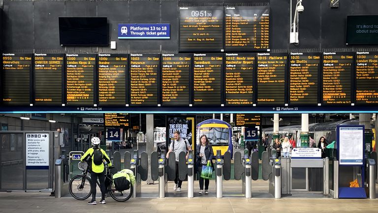 Commuters and travellers at Edinburgh&#39;s Waverley Station. ScotRail&#39;s new timetable, which will see almost 700 fewer train services a day across Scotland, begins today whilst the deadlock over driver pay continues. Picture date: Monday May 23, 2022.