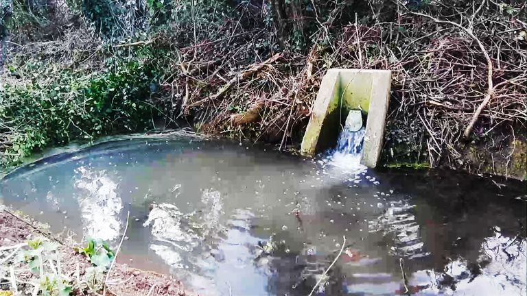 Sewage spills at river site
