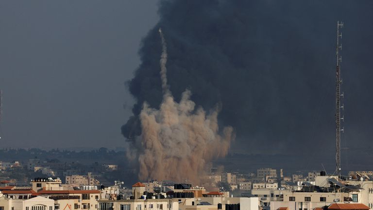 Smoke rises from Israeli strikes as rockets are fired from Gaza towards Israel, in Gaza, October 10, 2023. REUTERS/Mohammed Salem
