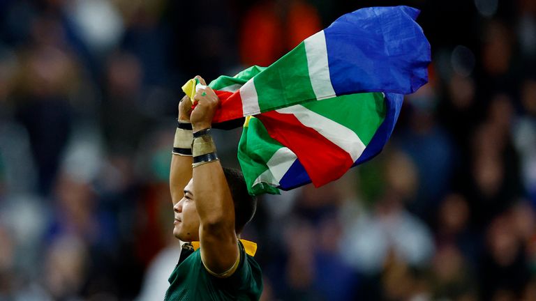 Rugby Union - Rugby World Cup 2023 - Final - New Zealand v South Africa - Stade de France, Saint-Denis, France - October 28, 2023 South Africa&#39;s Cheslin Kolbe celebrates with a flag after winning the world cup final REUTERS/Sarah Meyssonnier
