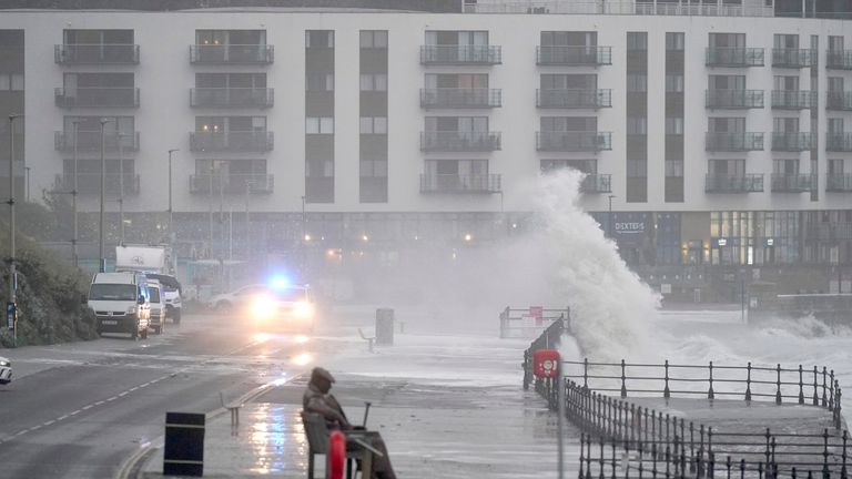 Waves crash near to the &#39;Freddie Gilroy&#39; sculpture by artist Ray Lonsdale in Scarborough, as Storm Babet batters the country 