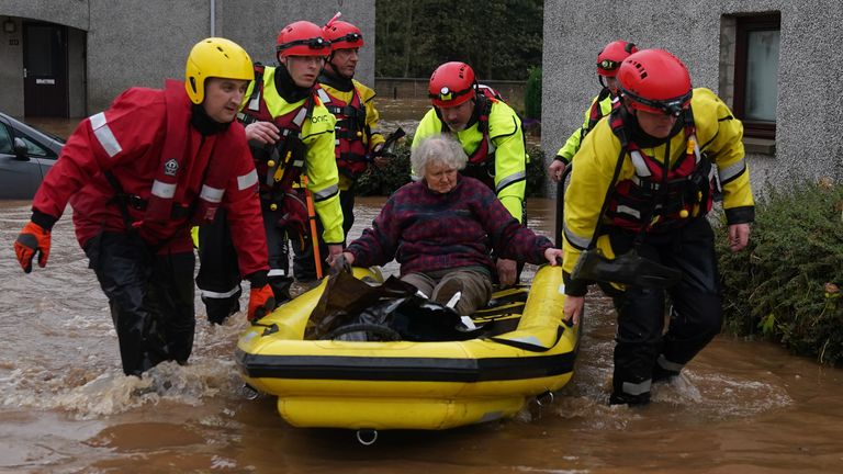 Members of the emergency services help local residents to safety in Brechin, Scotland, as Storm Babet batters the country. Flood warnings are in place in Scotland, as well as parts of northern England and the Midlands. Thousands were left without power and facing flooding from "unprecedented" amounts of rain in east Scotland, while Babet is set to spread into northern and eastern England on Friday. Picture date: Friday October 20, 2023.