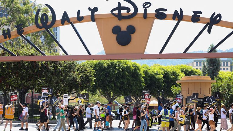 FILE PHOTO: SAG-AFTRA actors and Writers Guild of America (WGA) writers walk the picket line during their ongoing strike outside Walt Disney Studios in Burbank, California, U.S., August 22, 2023. REUTERS/Mario Anzuoni/File Photo