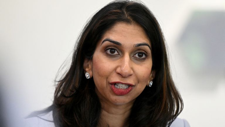  Suella Braverman speaks to volunteers during a visit to Bolton Lads and Girls Club  