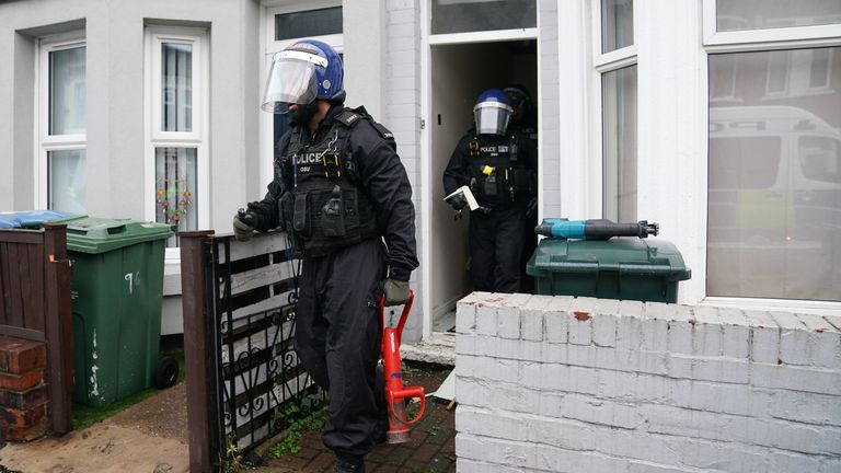 Officers from West Midlands Police gain entry into a property during a county lines raid in Coventry attended by   Suella Braverman