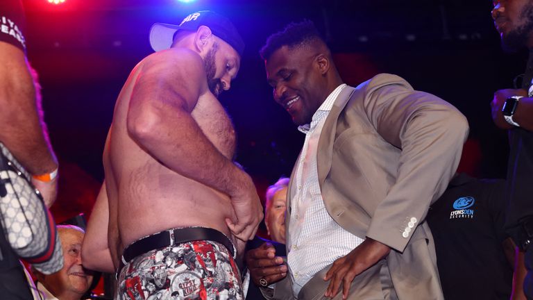 Tyson Fury jokes about his weight during face-off with Francis Ngannou in London. Pic: Action Images via Reuters/Andrew Boyers