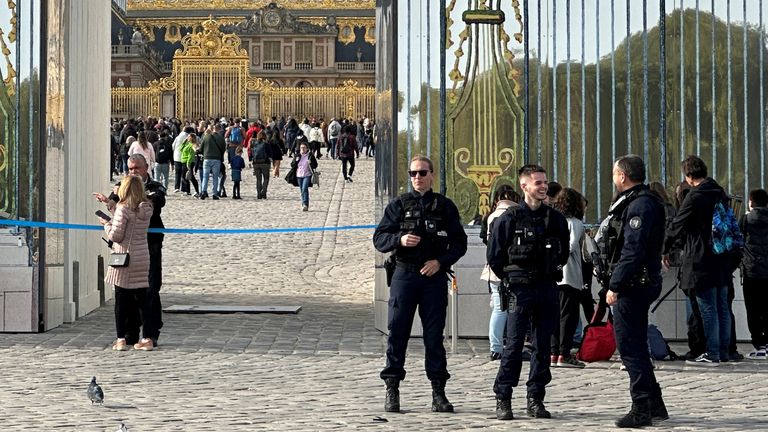 French police at Versailles after it was evacuated on Tuesday 