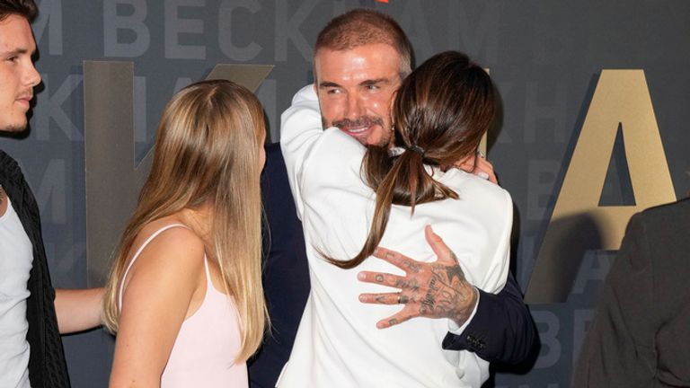 Victoria gives David a hug on the red carpet