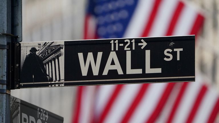The Wall Street sign is pictured at the New York Stock Exchange (NYSE) in the Manhattan borough of New York City, New York, USA, March 9, 2020. REUTERS/Carlo Allegri