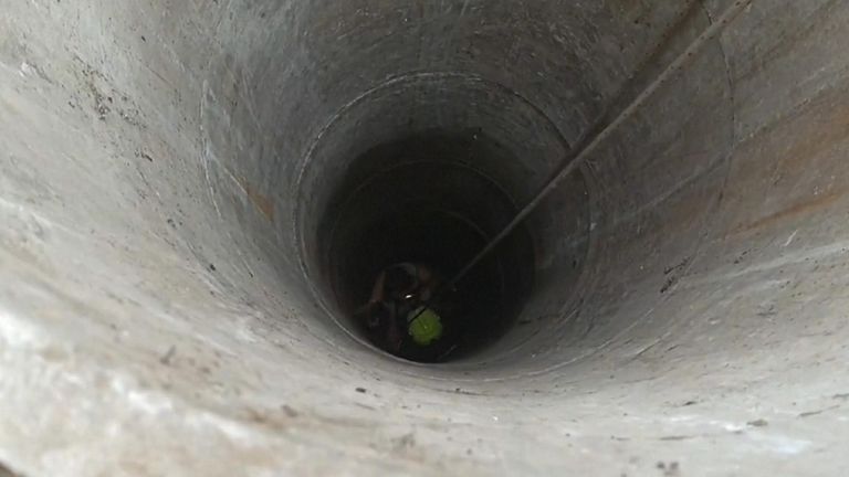A teenager who fell into a well in the yard of her family house in Hungary has been rescued. Pic: HU RTLK