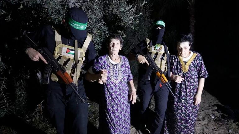 This image released by Al Qassam brigades (Hamas&#39;s military wing) on its Telegram channel, shows Yocheved Lifshitz, 85, center, and Nurit Cooper, 79, being escorted by Hamas as they are released to the Red Cross in an unknown location Pic: AP