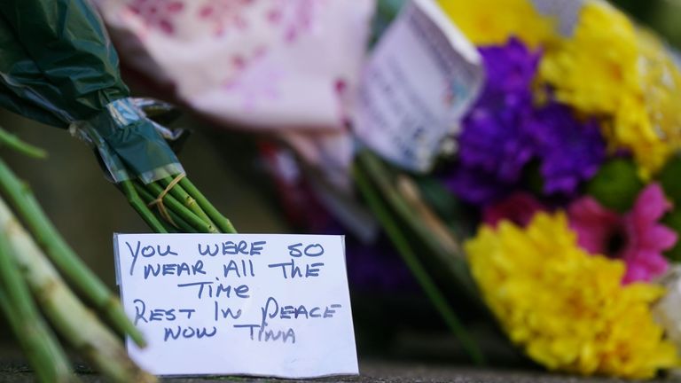 Flowers and messages left near to the scene in Youghal, Co. Cork, where a property is being searched in the case of missing woman Tina Satchwell. Gardai investigating her disappearance have found skeletal remains at the property. Picture date: Friday October 13, 2023.