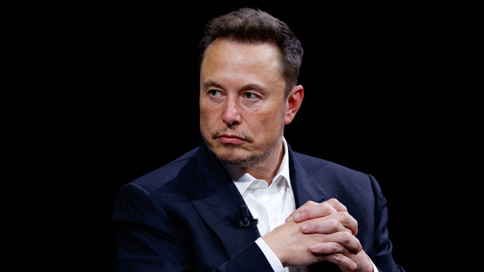 Elon Musk apologises for antisemitic X post - but tells fleeing advertisers to 'go f*** yourself'