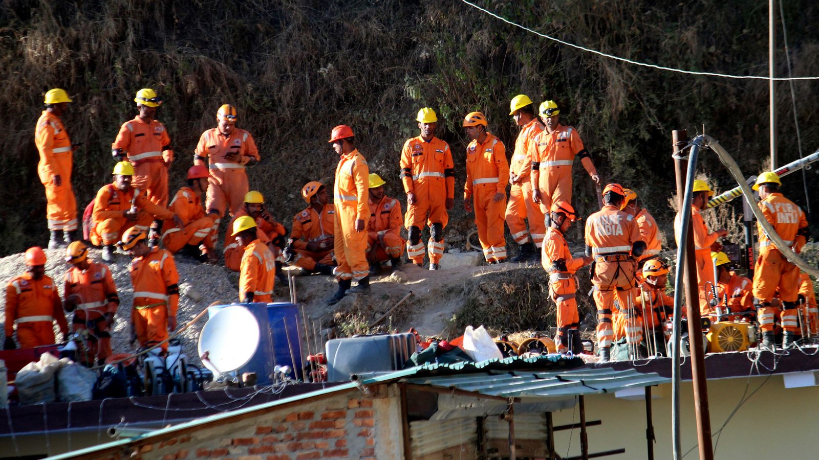 India tunnel rescue delayed: 41 workers still trapped after drill damaged and rescuers forced to dig by hand