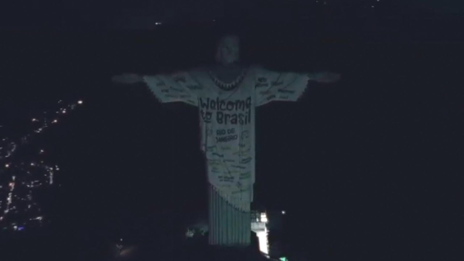 Taylor Swift T-shirt projected onto Brazil's Christ the Redeemer