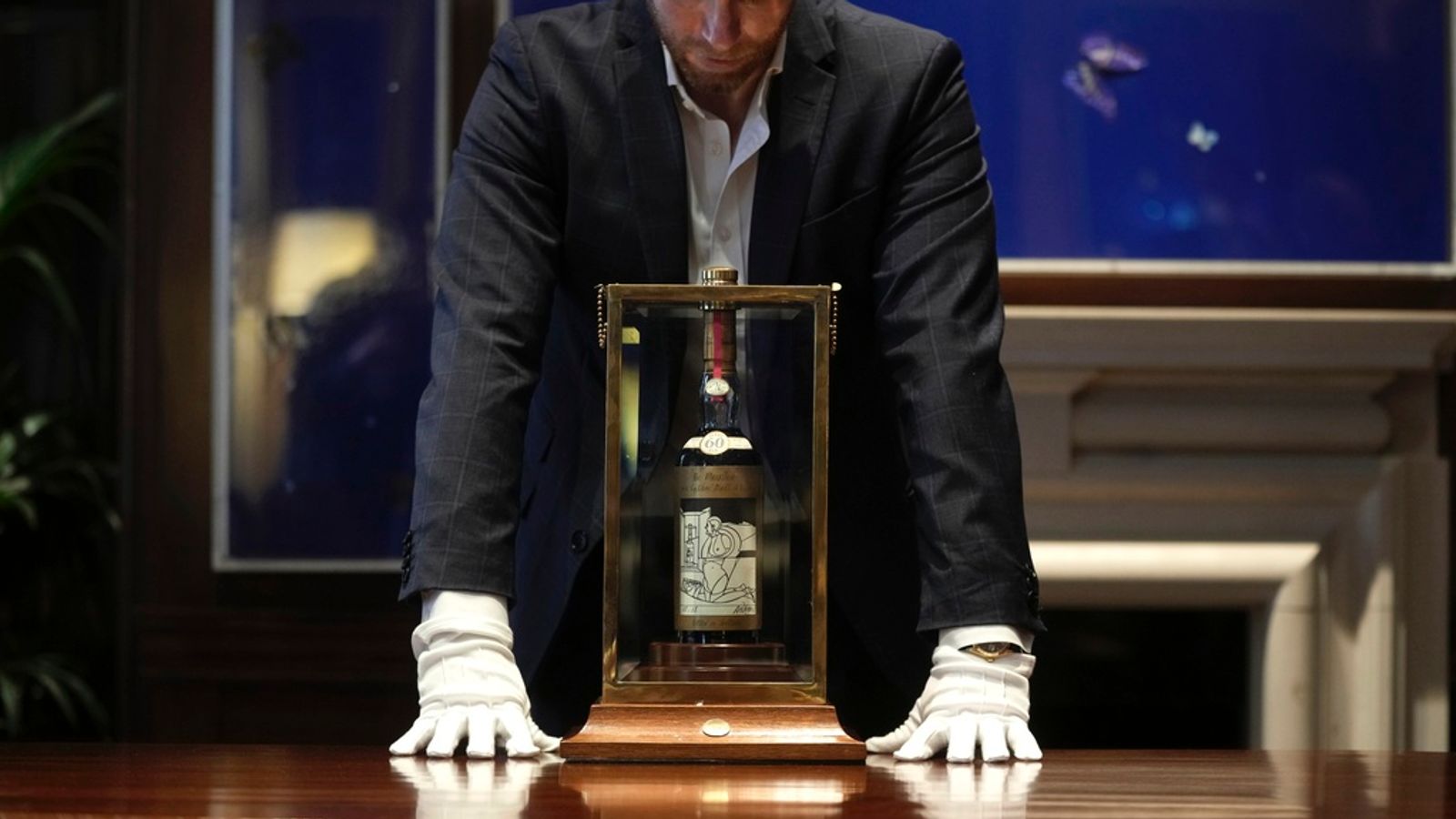 Bottle of almost 100-year-old whisky smashes auction record