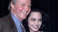 Jon Voight poses with daughter Angelina Jolie at ShoWest March 9 in Las Vegas. Voight presented his daughter with the Supporting Actress of the Year award during a ShoWest awards show. ShoWest is an annual convention of movie theater owners. SM/JP