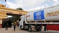 A trailer loaded with fuel heads for Gaza at the Rafah Border Crossing in Rafah, northeastern Egypt on November 22, 2023. The logo of the United Nations Relief and Works Agency for Palestine Refugees (UNRWA) is pasted on the side of trailer.( The Yomiuri Shimbun via AP Images )