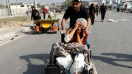 A Palestinian woman, who was injured in an Israeli strike and was staying at Al Shifa hospital, moves southward after fleeing north Gaza as Israeli tanks roll deeper into the enclave, amid the ongoing conflict between Israel and Hamas, in the central Gaza Strip November 10, 2023. REUTERS/Ibraheem Abu Mustafa TPX IMAGES OF THE DAY