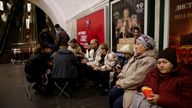 People take shelter in a metro station in Kyiv