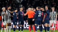PSG players surround Referee Szymon Marciniak appealing for a penalty. Pic: AP