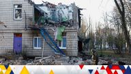 Police officers inspect the compound of a kindergarten damaged during Russian drone strikes, amid Russia’s attack on Ukraine, in Kyiv, Ukraine November 25, 2023. REUTERS/Valentyn Ogirenko