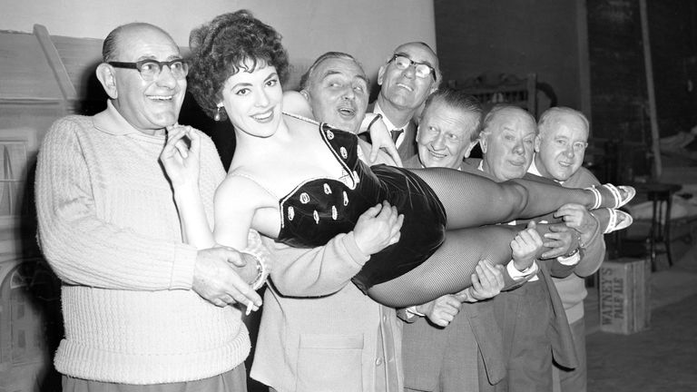 Anne Hart gets full support from the Crazy Gang as she starts rehearsals with them at the Victoria Palace in 1959