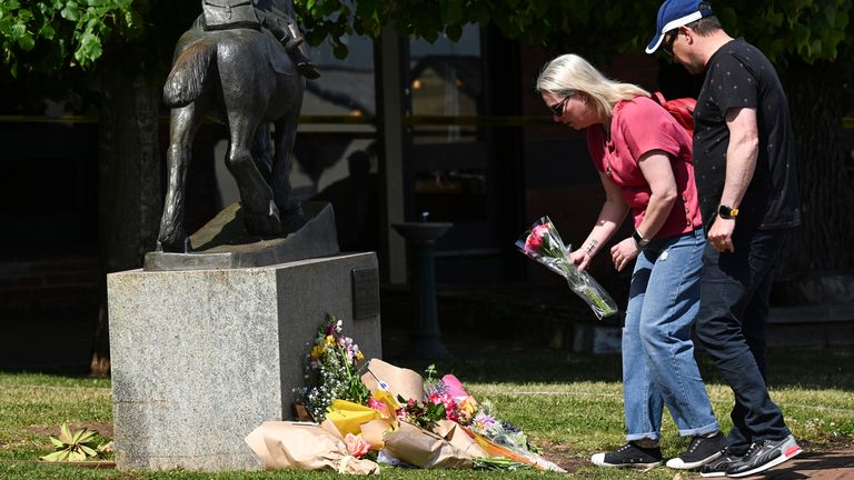 Mourners lay flowers outside the Royal Hotel in Daylesford, Australia, Monday, Nov. 6, 2023. A car crashed into an Australian pub...s outdoor dining area, killing and injuring multiple people, officials said on Monday. (James Ross/AAP Image via AP)