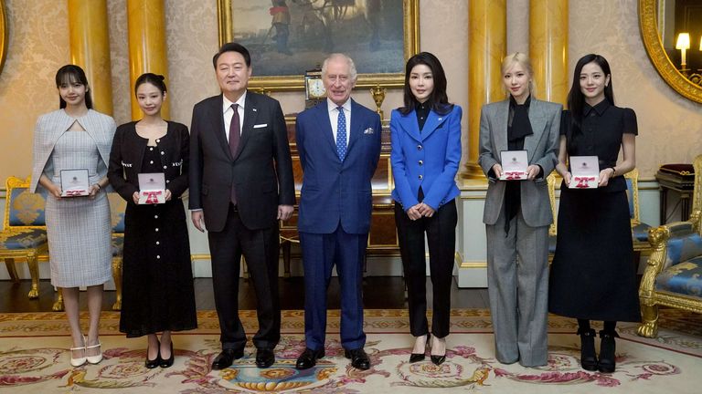 (Left to right) Lisa (Lalisa Manoban), Jennie Kim, President of South Korea Yoon Suk Yeol, King Charles III, First Lady of South Korea Kim Keon Hee, Rose (Roseanne Park), and Jisoo Kim following a special investiture ceremony to present the members of the K-Pop band Blackpink with Honorary MBEs (MBE (Member of the Order of the British Empire), conducted by King Charles in the presence of the President and his wife at Buckingham Palace, London. Picture date: Wednesday November 22, 2023.