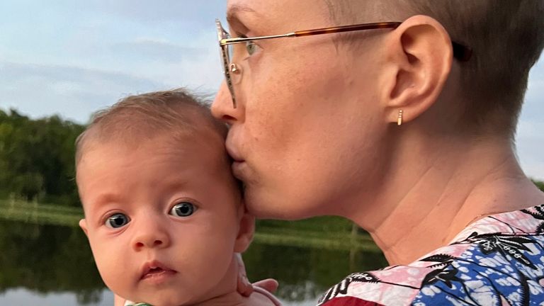 This family photo shows Casey McIntyre and her daughter, Grace. Less than a week after her death from cancer on Sunday, Nov. 12, 2023, the New York woman has raised enough money to erase more than $13 million in medical debt for others with a posthumous plea for help. (Andrew Rose Gregory via AP)