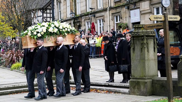 The coffin of Sir Bobby Charlton is carried by pallbearers into Manchester Cathedral 