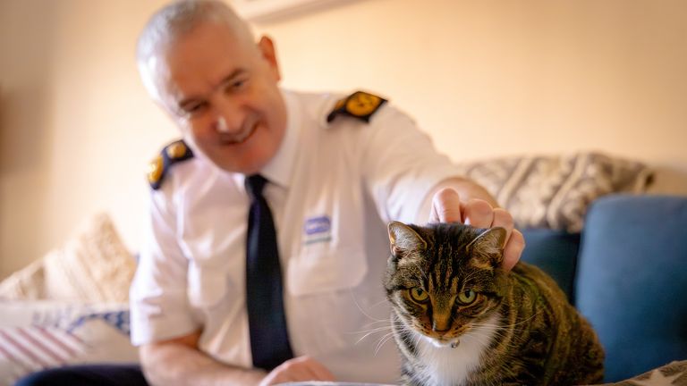 Dermot Murphy with rescued cat Shelia. Pic: RSPCA