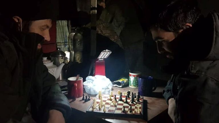 Service members of Mariupol&#39;s unit of the Ukrainian Sea Guard play chess inside a bunker of the Azovstal Iron and Steel Works, amid Russia&#39;s invasion of Ukraine, in Mariupol, Ukraine in this handout picture released on May 15, 2022. Press-service of the State Border Guard Service of Ukraine/Handout via REUTERS THIS IMAGE HAS BEEN SUPPLIED BY A THIRD PARTY. MANDATORY CREDIT. REUTERS IS UNABLE TO INDEPENDENTLY VERIFY THE AUTHENTICITY, CONTENT, LOCATION OR DATE OF THIS IMAGE. BEST QUALITY AVAILABLE