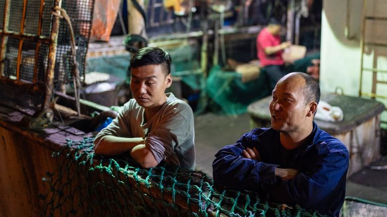 Chinese workers being interviewed on board squid fishing ship. Pic: Ed Ou